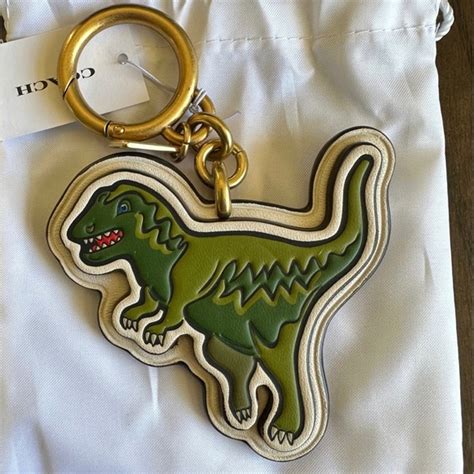 little gold dinosaur with chain coach charm made in china